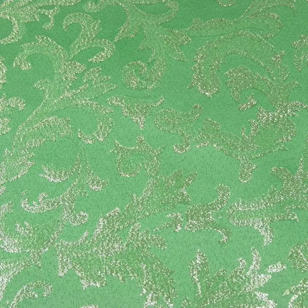 Tessuto di cotone verde con motivi barocchi scintillanti e senza tempo, larghezza 280 cm